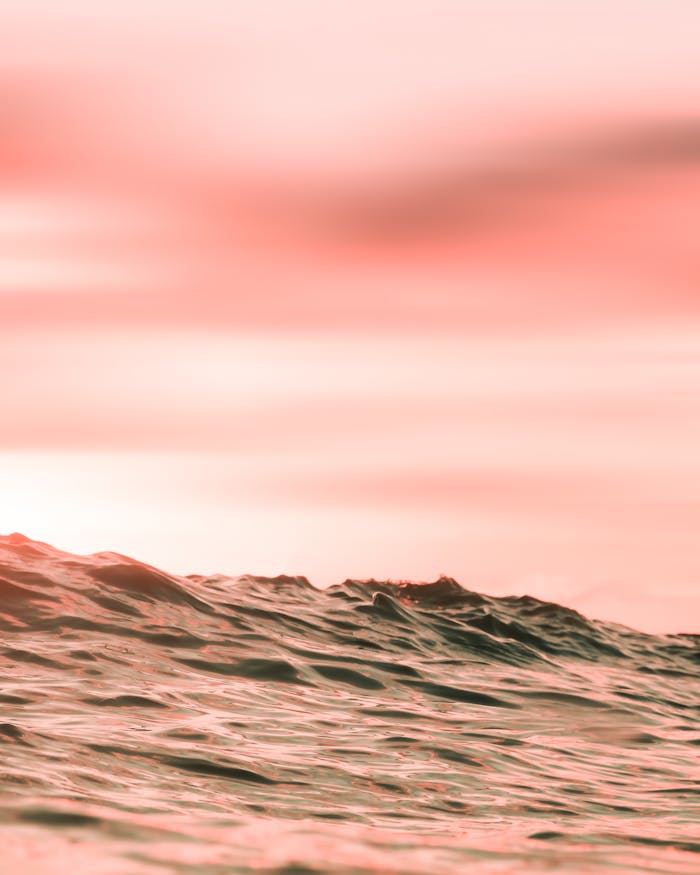 Close-Up Shot of Sea Waves During Sunset